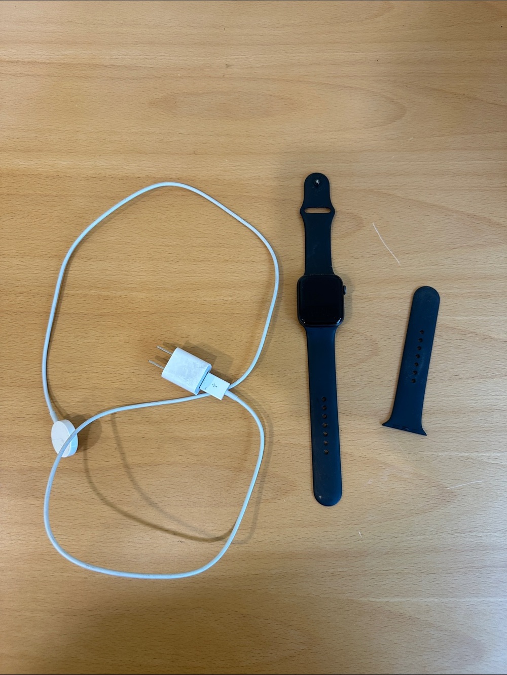 Apple Black Smartwatch with Black Silicone Band and Charger